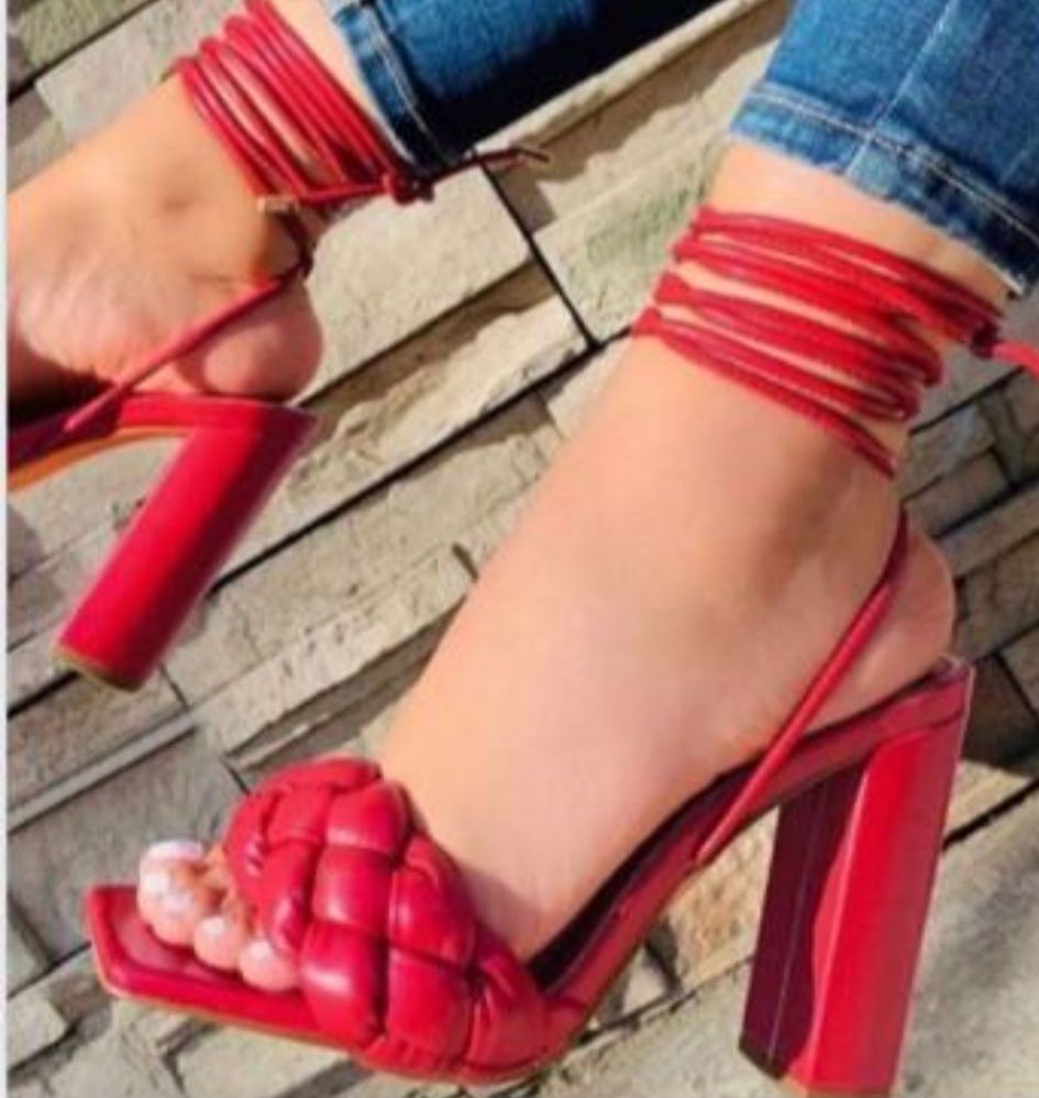 Leather sandals with a 10 cm square block heel and leg wrap ties, offering a bold and stylish look with added support